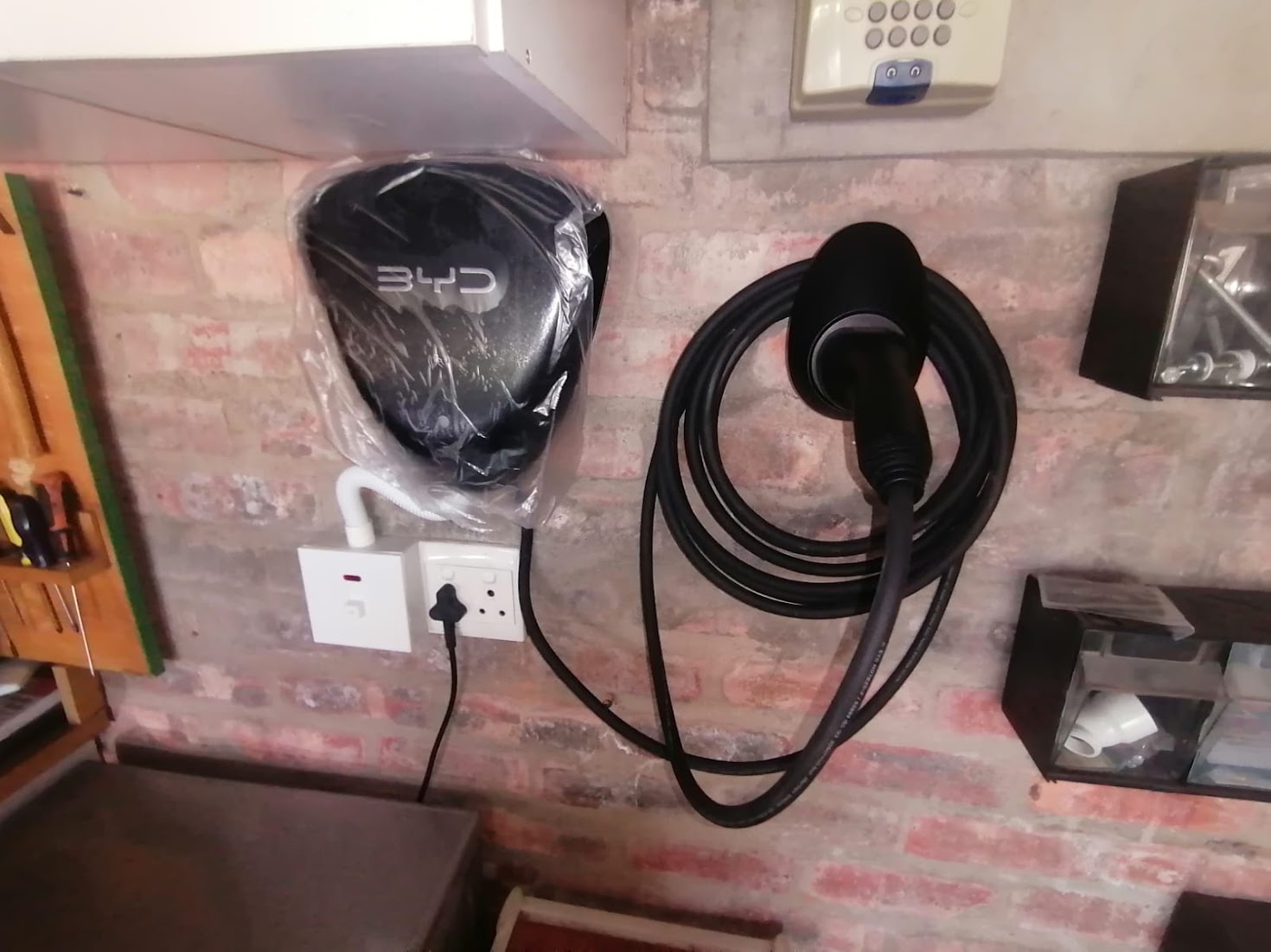 BYD home charger mounted on face brick, newly installed