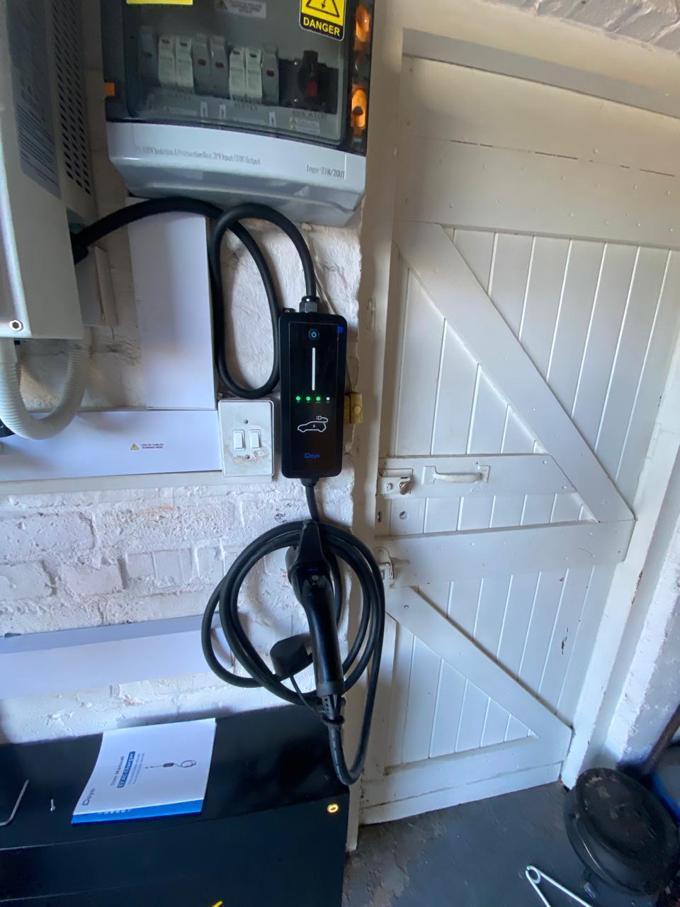 Deye EV charger installed alongside an inverter and distribution board
